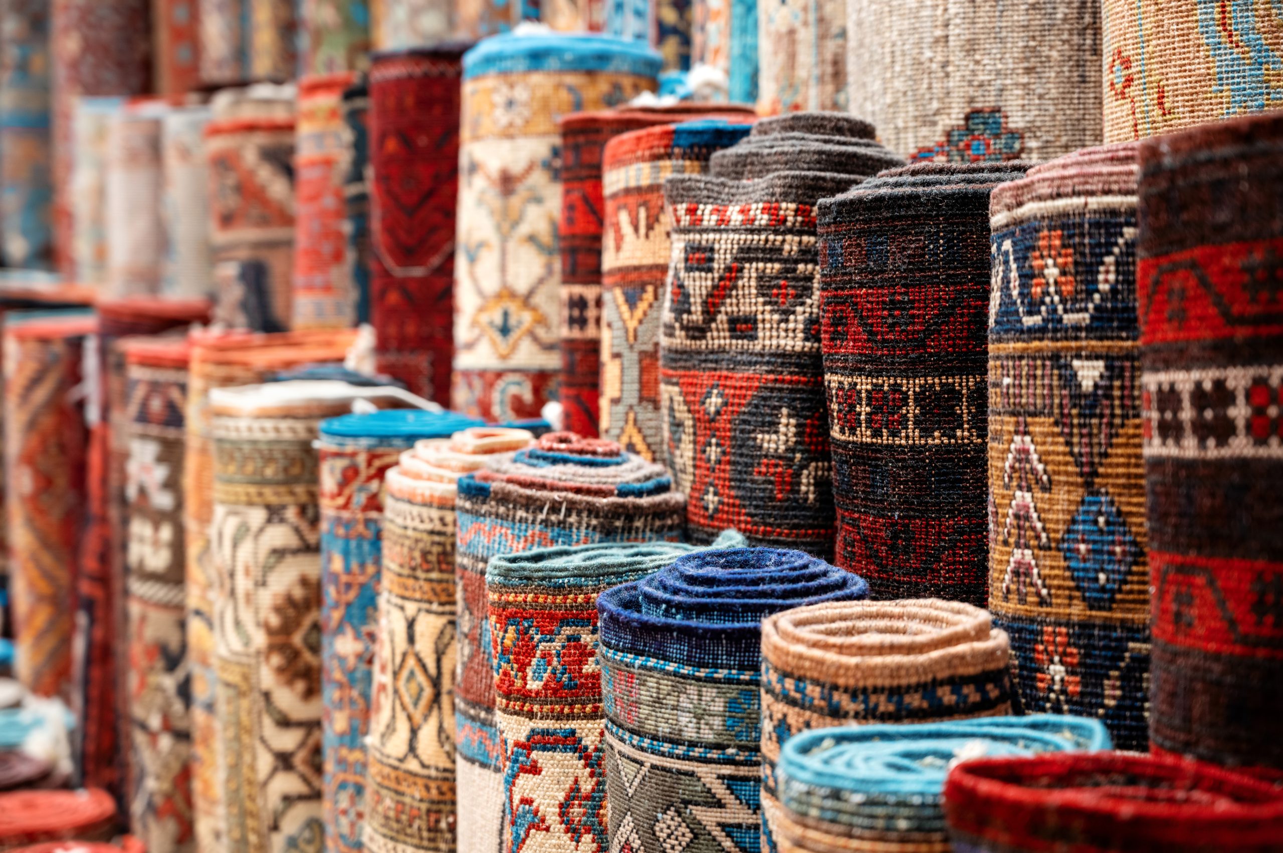 View of multiple carpets for sale at the Grand Bazaar in Istanbul, Turkey
